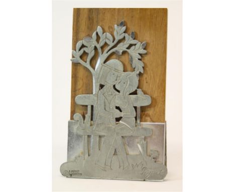 A pewter panel by Raymond Peynet.  From the "Les Amoureux" collection.  Mounted on a wooden board.  11cm high.  