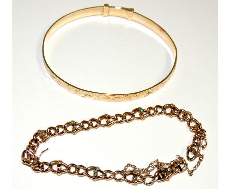A ladies 9ct gold, adjustable bangle with engraved floral decoration, 13.5 g approx., and a ladies 9ct gold link bracelet set