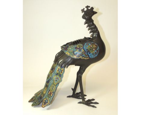A 19th Century Chinese cloisonne bronze Peacock censor, the bird with head raised, the wings lifting off to reveal inner comp