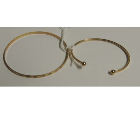 A thin 9ct gold bangle with bright-cut leaf decoration, and another 9ct torque-style bangle.  (2)  6.8 g approx.