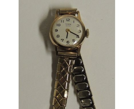 A ladies "TUDOR ROYAL" 9ct gold cased wristwatch on expanding strap.  The inner case marked "ROLEX".  The off white dial with