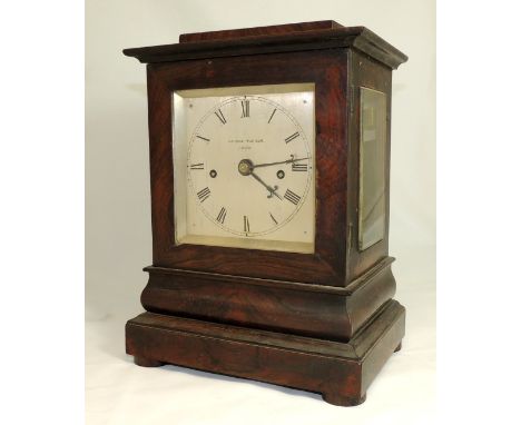 A Rosewood veneered mantel clock, the square silvered dial marked "GEORGE WADHAM, BATH", the four glass case with bevelled to