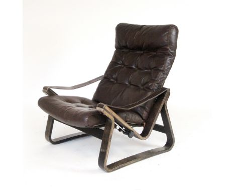 A 1970's adjustable bentwood armchair with highback brown button upholstery, in the manner of Westnofa