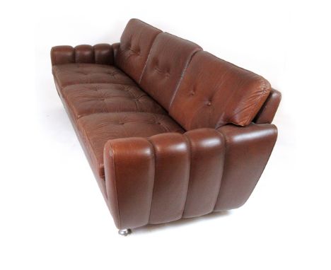 A 1970's Skippers Mobler brown leather three seater sofa with button upholstery CONDITION REPORT: Scuffs along front