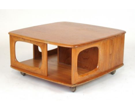 An Ercol elm occasional table on castors, w. 79 cm CONDITION REPORT: Deficient of drawers. Wear to surface. Structurally soun