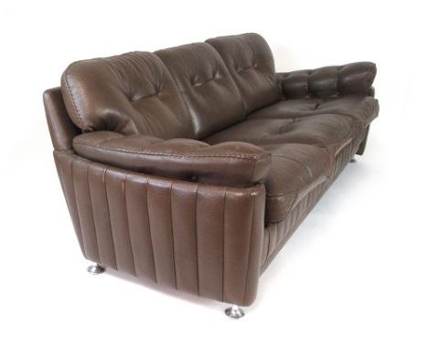 A 1970's brown leather three seater sofa with button upholstery and stitched detail, by Vatne Mobler, possibly designed by Fr