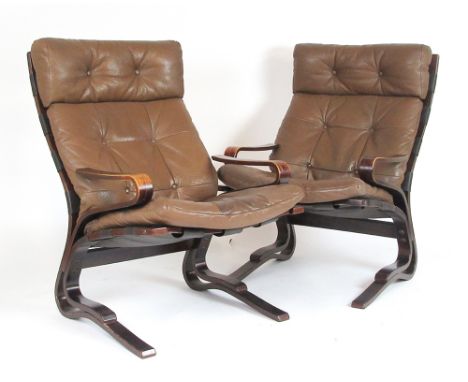 Attributed to Ingmar Relling for Westnofa, a pair of 1970's brown leather button upholstered 'Siesta' chairs with bentwood fr