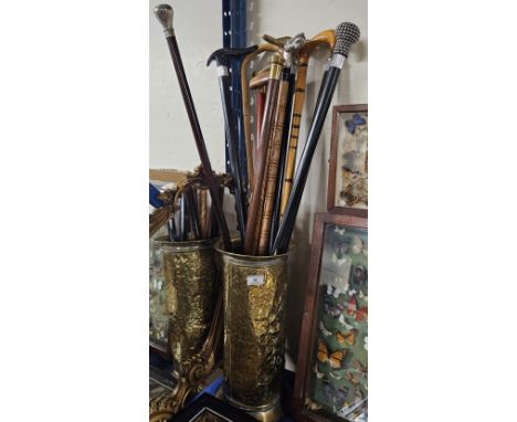 BRASS STICK STAND WITH 11 COLLECTABLE WALKING STICKS, GILT SHAPED MIRROR      
