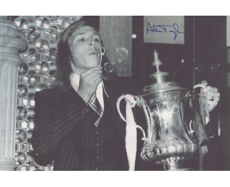 Autographed ALAN TAYLOR 12 x 8 photo : B/W, depicting West Ham United's ALAN TAYLOR blowing bubbles for photographers as he p