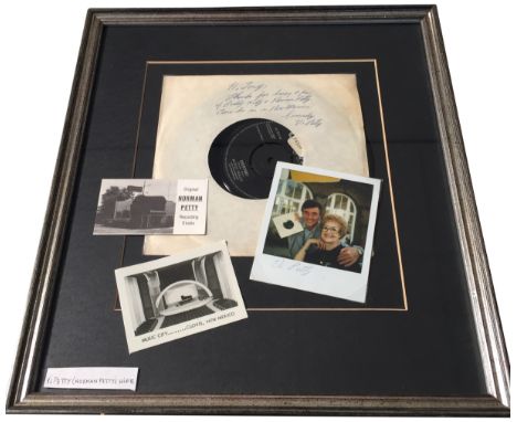 BUDDY HOLLY - NORMAN/VI PETTY. A mounted and framed presentation to include a copy of Buddy Holly - Everyday signed to plain 