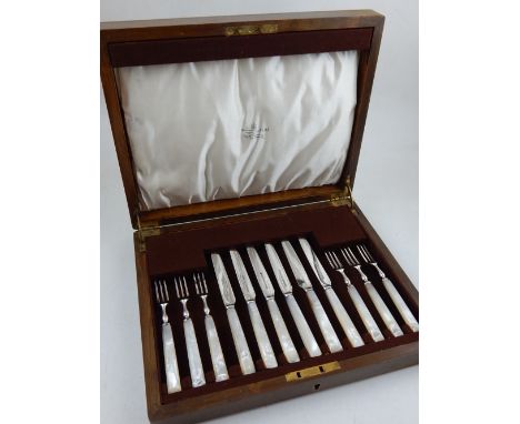 A Mappin & Webb mother of pearl handled dessert knife and fork set, boxed.