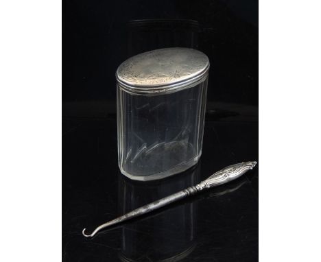 A Victorian silver mounted glass toilet jar, makers mark 'W.G', London 1889, together with an Edwardian silver mounted button