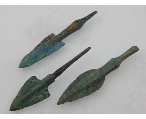 Three bronze arrow heads.