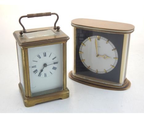 A 20th century carriage timepiece, the white enamel dial set out with Roman numerals in a corniche case, H. 11cm, together wi
