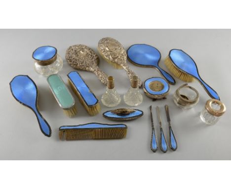 George V silver backed and blue enamelled dressing table set, comprising mirror, three brushes, comb, jar and cover, alarm cl