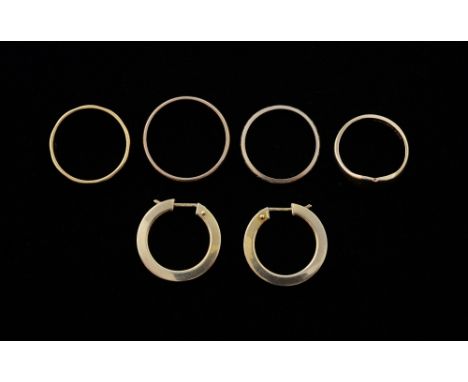 Gold jewellery, a pair of hoop earrings, three wedding bands and a signet ring 