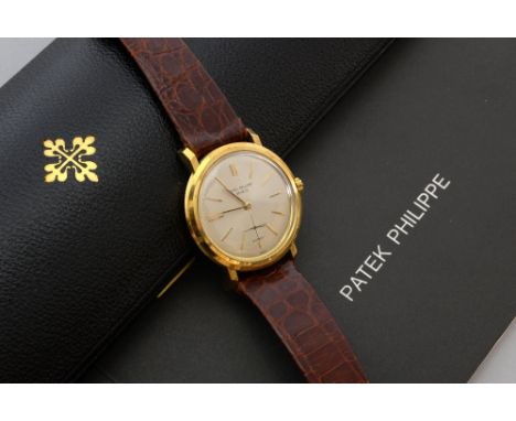 Patek Philippe automatic watch, 18 carat gold ,ref. 3440, silvered brushed dial, applied gold baton numerals, signed Patek Ph