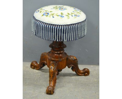 19th Century walnut adjustable piano stool.  Diameter 35cm.