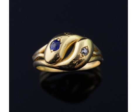 An Victorian double headed gold snake ring, set with a s sapphire and diamond to each head, mounted in 18 ct yellow gold. Cir