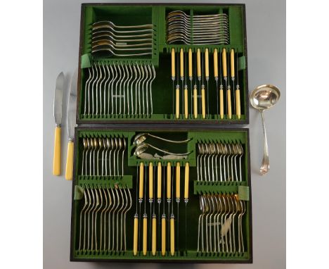 George V silver canteen of cutlery for twelve, comprising dinner forks, teaspoons, dessert spoons, grapefruit spoons, dessert