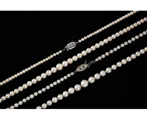 Two cultured pearl necklaces, on 9ct white gold clasps 
