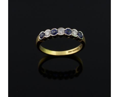 Seven stone sapphire and diamond ring, in a white gold rub-over setting mounted in 18 ct gold