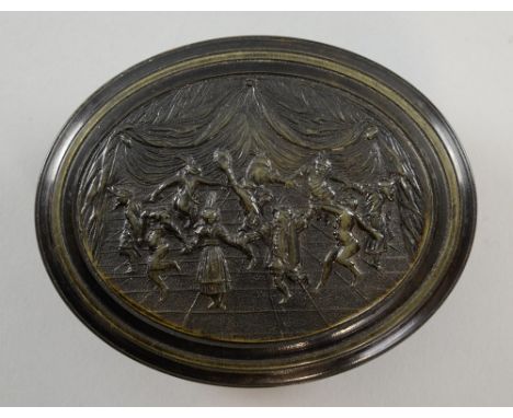 Early 18th century oval pressed horn snuff box, the cover with a design taken from an engraving of the round dance by Jacques