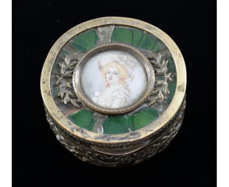 Late 19th/ early 20th century French brass circular box, the cover inset with a painted portrait of a lady, 7cm diameter,