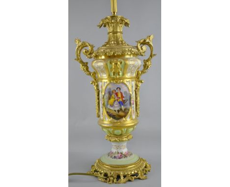 Early 20th Century porcelain and gilt metal lamp decorated with flowers.  Height 67cm