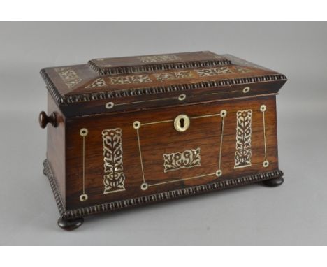 19th century rosewood and mother of pearl tea caddy, with cut glass mixing bowl flanked by two compartments 47cm wide 