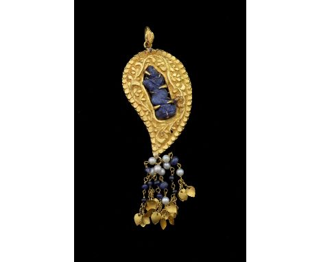 Gold pendant with blue sapphire, carving to centre with sapphire and pearl tassel, metal tested as 18ct or higher 