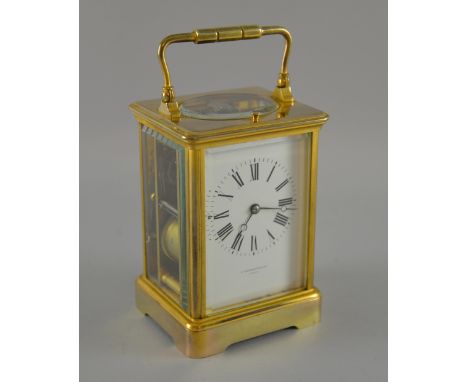 French Brass repeating carriage clock by E.M & Co, The white enamel dial signed J Dwerryhouse, Paris. Repeating the hours, an