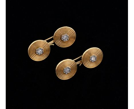 Pair of gold and diamond cufflinks, the double links of circular shape set with a single cut diamonds to the centre with gold