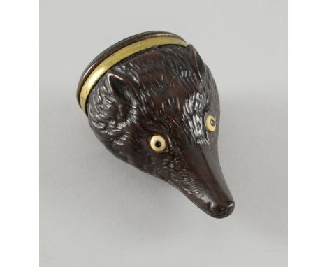 Mid 19th century treen snuff box in the form of a fox's head with a brass band. The oval cover with an unmarked white metal m
