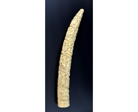 19th century Loango carved ivory tusk with seven tiers of figures and animals, 44cm long,PROVENANCE: Owned by the vendors fat