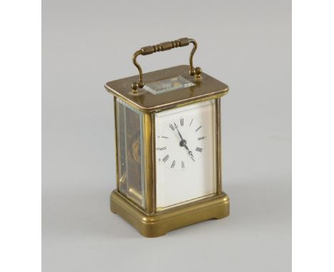 French brass carriage clock with white enamel dial, height 15cm.