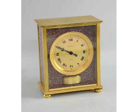 REVISED ESTIMATE: 20th C Jaeger LeCoultre Atmos 'Elysee' mantel clock, in a gilt metal  red marble  finish case, with a circu