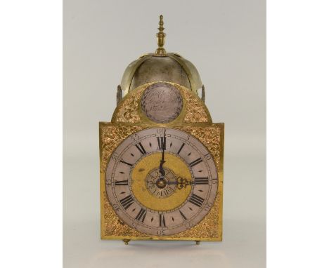 An 18th century brass lantern wall Clock by George Clarke London, with alarm, two weights 40cm high 