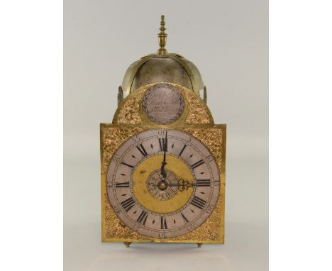 An 18th century brass lantern wall Clock by George Clarke London, with alarm, two weights 40cm high 