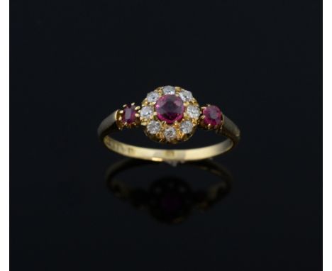 Edwardian ruby and diamond ring, ruby to the centre to a surround of old cut diamonds and a ruby to each shoulder mounted in 