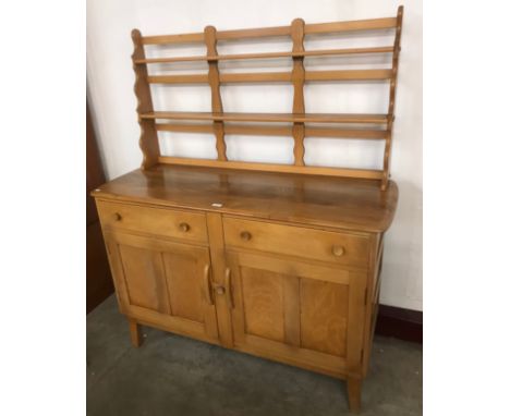 An Ercol Blonde elm and beech Windsor dresser 