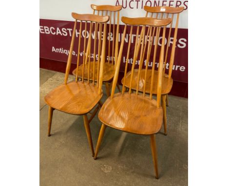 A set of four Ercol Blonde elm and beech Goldsmith chairs 
