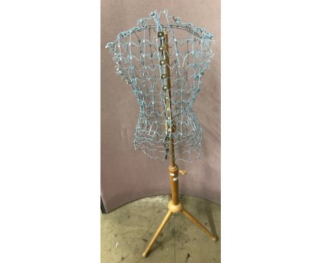 A wire mannequin on stand 