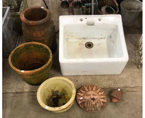 A Belfast sink, a terracotta chimney-pot, two planters, terracotta bird feeder and a small hedgehog garden figure
