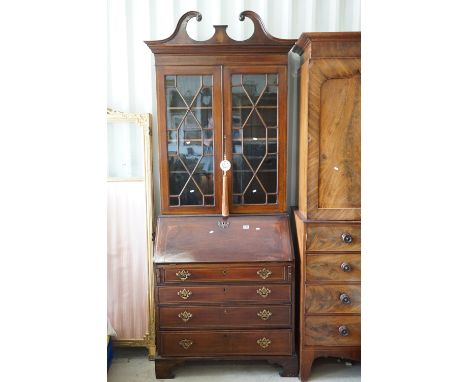 George III Mahogany Inlaid Bureau Bookcase, the upper section with break swan neck pediment and two astragel glazed doors ope