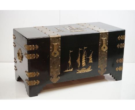 Art Deco South East Asian Black Lacquered Camphorwood Blanket Box, the brass studded strapping engraved with dragons, the fro