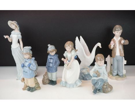 Seven Nao ceramic figurines in their original boxes. The lot to include lady with a butterfly, boys in duffel coats, swan gir