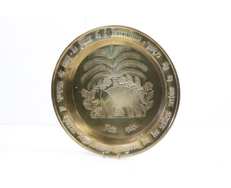 A large vintage brass charger plate presented to Miss C.F Hearnshaw for her selfless service to Queens School Enugu Nigeria N