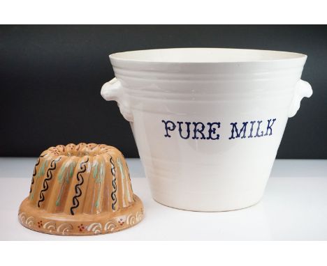 Victorian style ceramic milk pale of tapering form having moulded twin handles and 'pure milk' to the front, together with a 