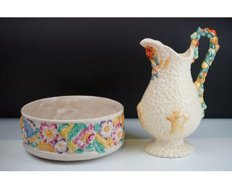 Clarice Cliff for Newport Pottery celtic harvest jug having a moulded fruit handle together with a bird and flower pattern fr